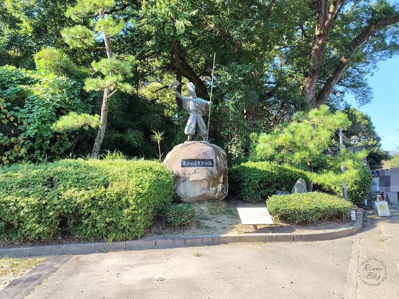 清正公石曳きの像